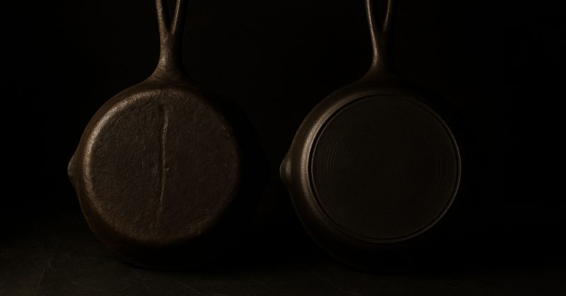 Two skillet undersides side by side showing different casting eras