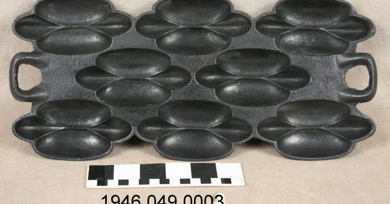 Gem and muffin pans - Unique form of cast iron muffin pan has 8 concave detailed sections; made by St. Louis company G.F. FilleyTitle: Oblong 